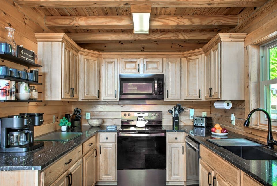 Kitchen is has an Electric Range and lots of Small Appliances