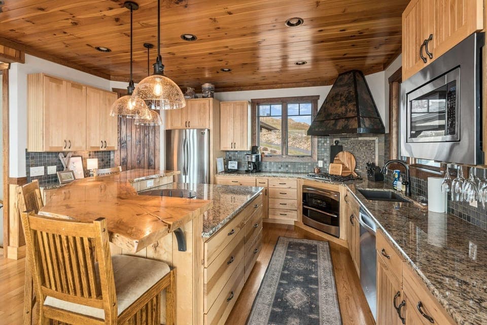 Custom Wood Bar, Granite Counters and High End Appliances