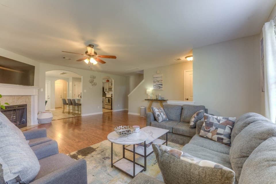 Living room space looking into the dining room and kitchen 
