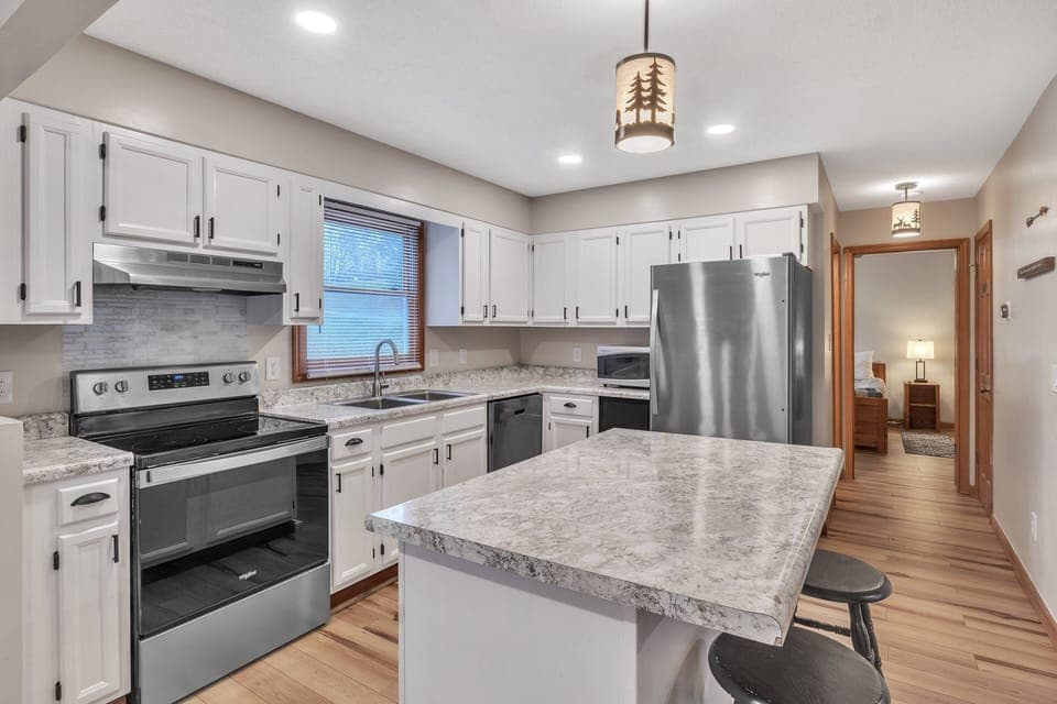 Kitchen with island and main-level bedroom