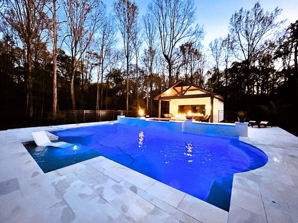 Oversized pool with tanning ledge and waterfalls. (1)