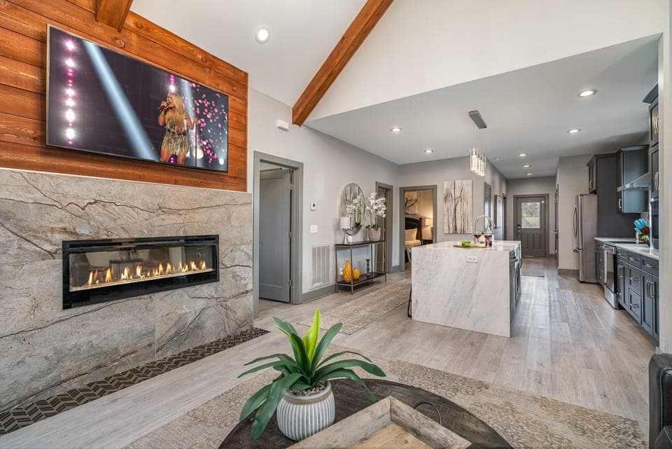 Bright and inviting living room with cozy seating, vaulted ceilings, and stylish décor—perfect for relaxing after a day of exploring!