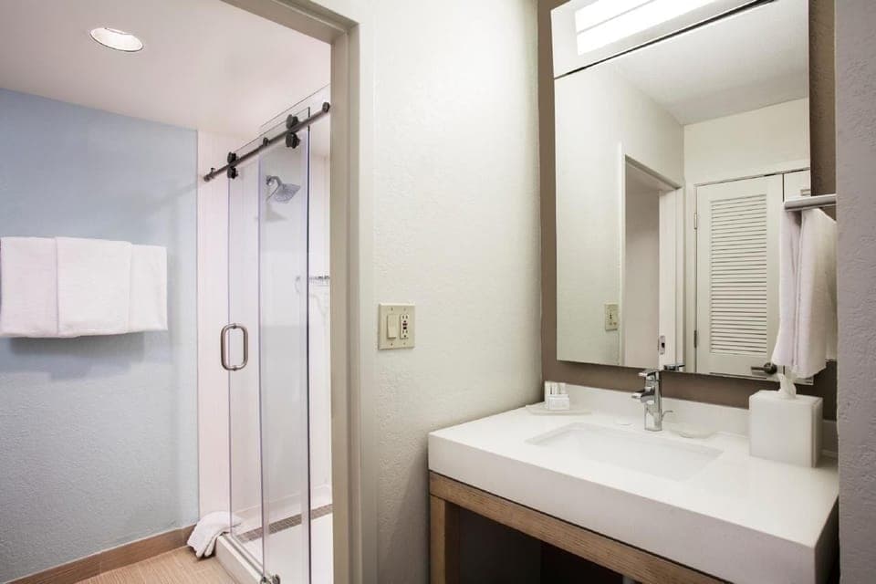 Refresh under a sleek glass shower after a long day.