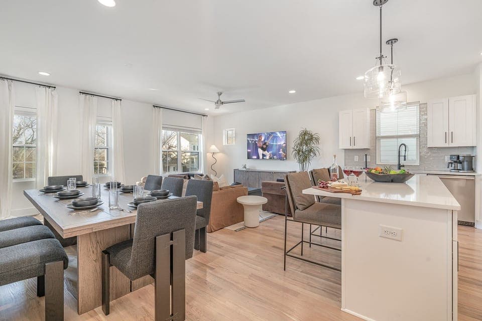 Gather around the spacious dining table for meals and conversation, creating lasting memories in this welcoming space.