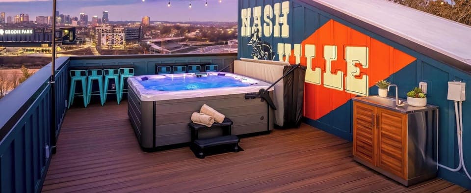 Discover luxury at this rooftop oasis in Downtown Nashville with stunning skyline views and a chic hot tub. Perfect for large groups or bachelorette parties, unwind under the stars and enjoy the vibrant energy of Music City—your ideal vacation rental for unforgettable memories!