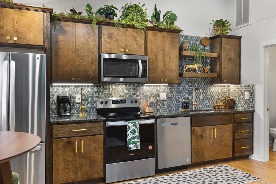 Fully equipped kitchen with all your cooking essentials, drip coffee maker + coffee. Dining table with seating for 2. This room opens up into the living room. Lush, vibrant decor throughout the entire condo!