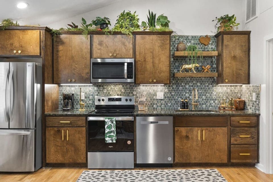 Fully equipped kitchen with all your cooking essentials, drip coffee maker + coffee. Dining table with seating for 2. This room opens up into the living room. Lush, vibrant decor throughout the entire condo!