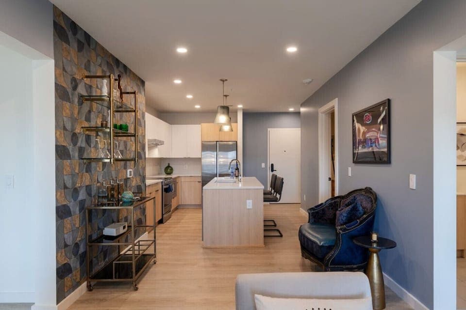 Stylish kitchen with sleek cabinetry, a central island, and a cozy seating area, creating a welcoming and functional living environment.