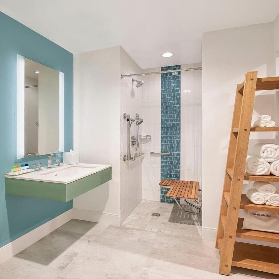 Rinse off comfortably with a bench seat and rain shower.