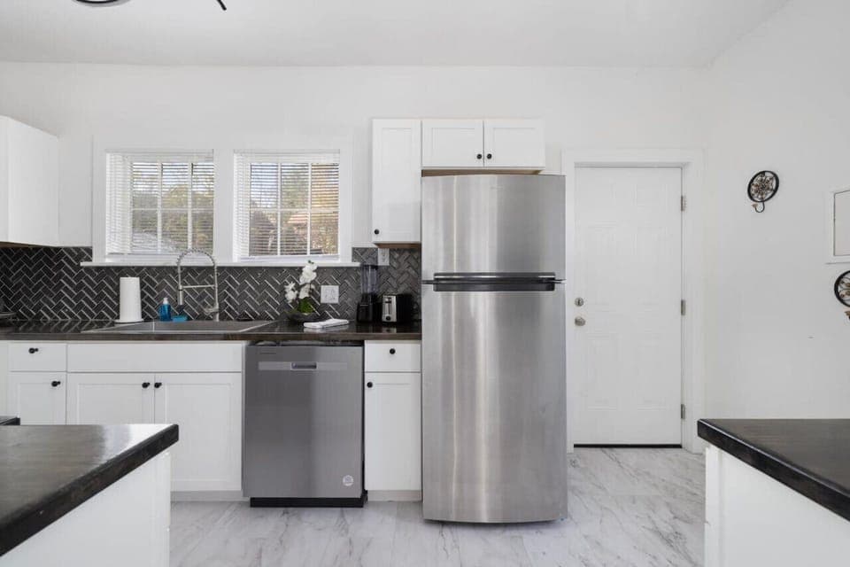 There is a dishwasher and refrigerator.