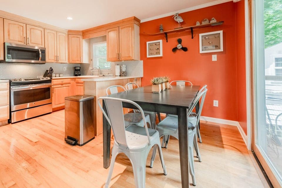 The dining room is located near the kitchen, allowing for each access for food to/from the table.