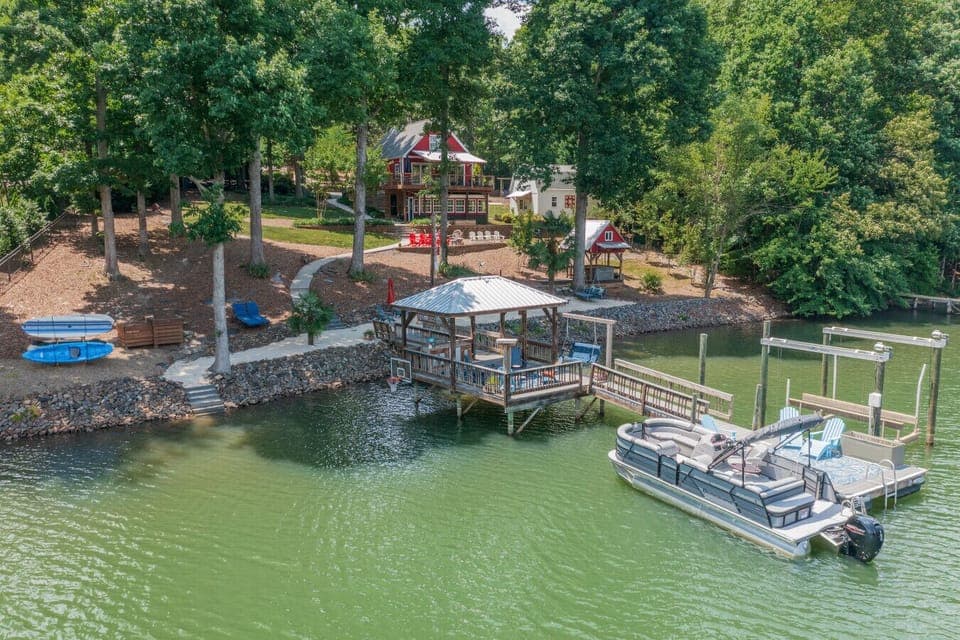 Have an unforgettable vacation at our home w/HUGE dock, kayaks, water toys, hot tub, basketball, you name it!