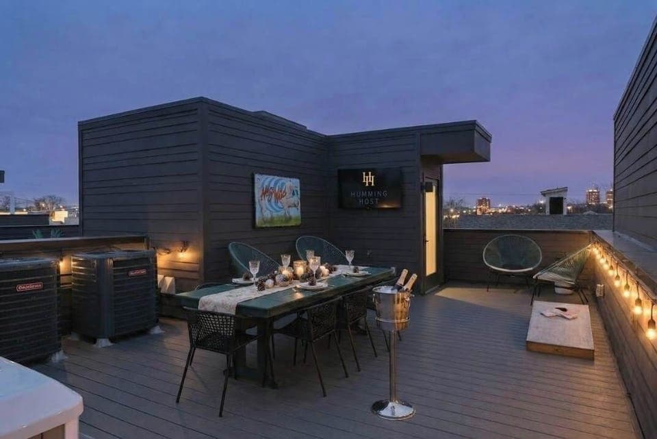 Rooftop oasis with games, dining table and flat screen TV for a perfect entertaining afternoon or evening 