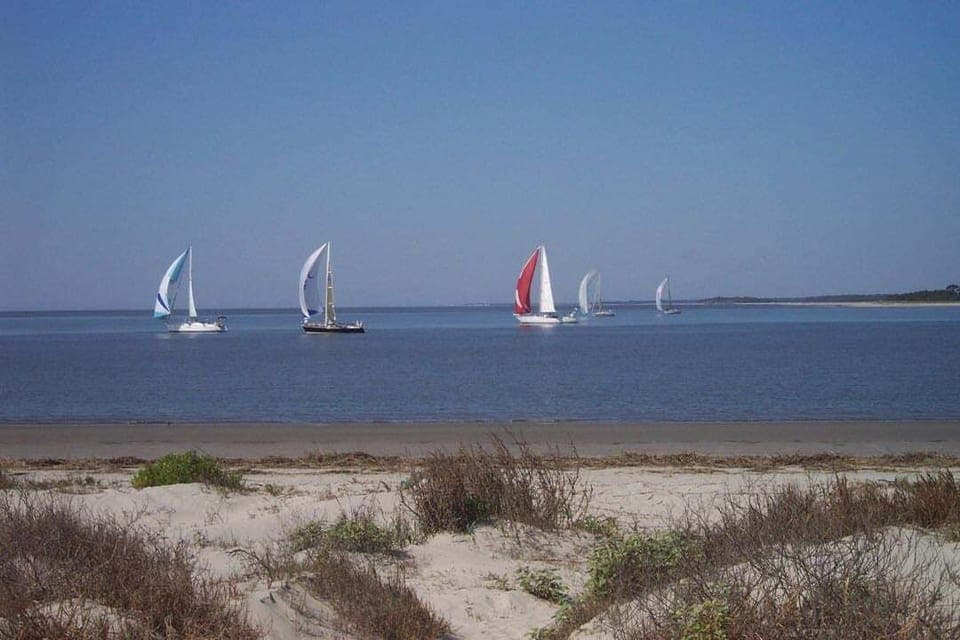 Welcome to 1340 - spectacular second floor villa views of ocean, beaches, neighboring islands, and Edisto river. Watch the occasional sail boat and shrimp trawler glide by from your private balcony or from the beach - a few steps away.