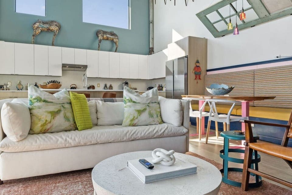 World of whimsy at Pie Town Emporium- Open concept living/dining/kitchen spaces. Enjoy extra sleeping space on the sofa bed.