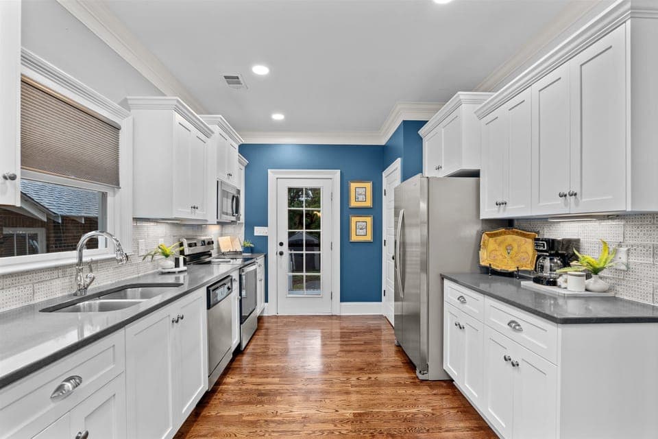 view of kitchen and back door to enter patio 