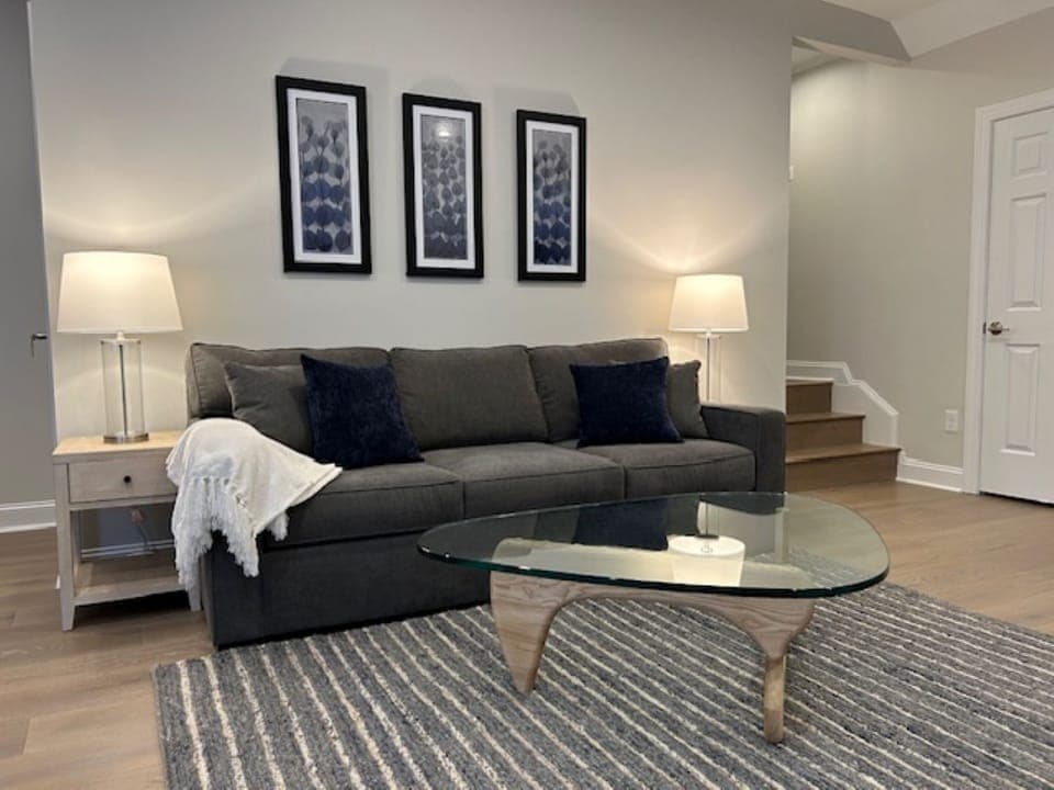 Living room features a queen sleeper sofa.