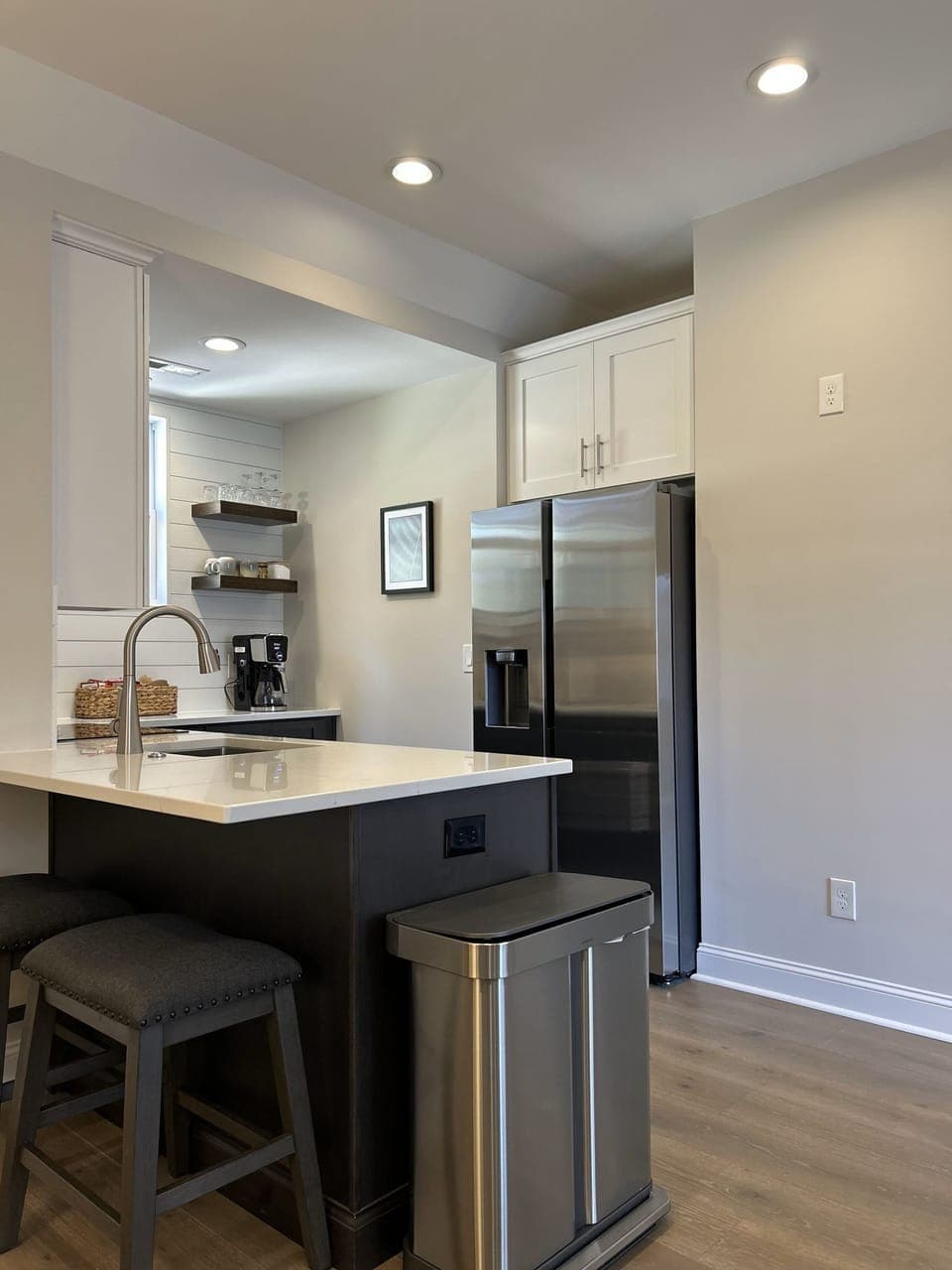 Fridge includes ice maker and filtered water dispenser. 