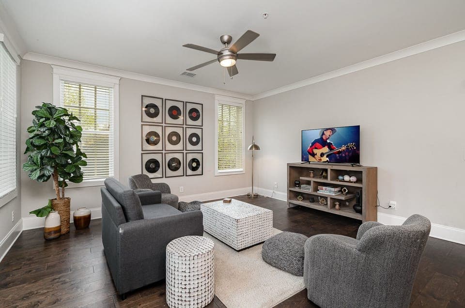 Unit 1: Open and inviting living space featuring a Smart TV and cozy furnishings.