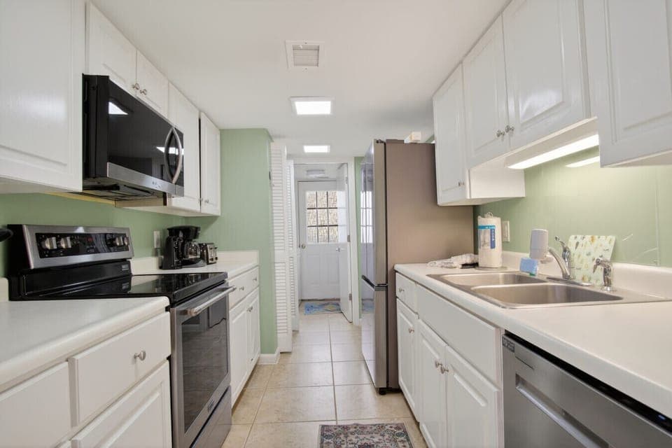 Kitchen off dining room with access to laundry room