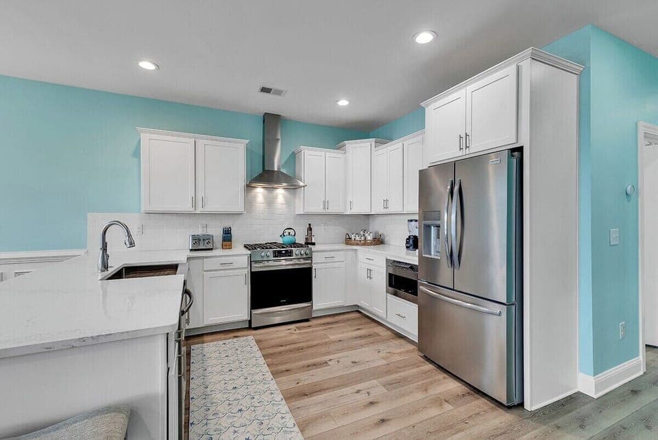 A clean, modern kitchen with stainless steel appliances and ample counter space.