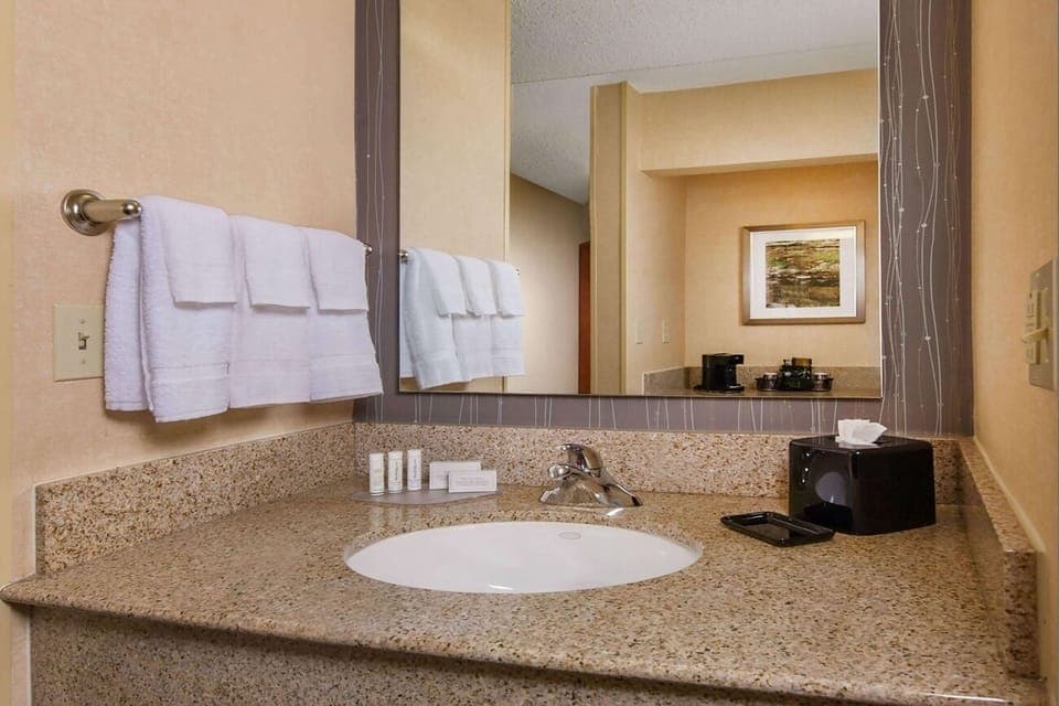 Refresh easily at the clean granite vanity with plush towels.
