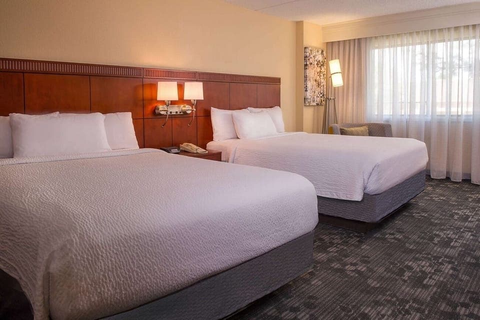 Unwind in crisp beds and soft light after adventures.