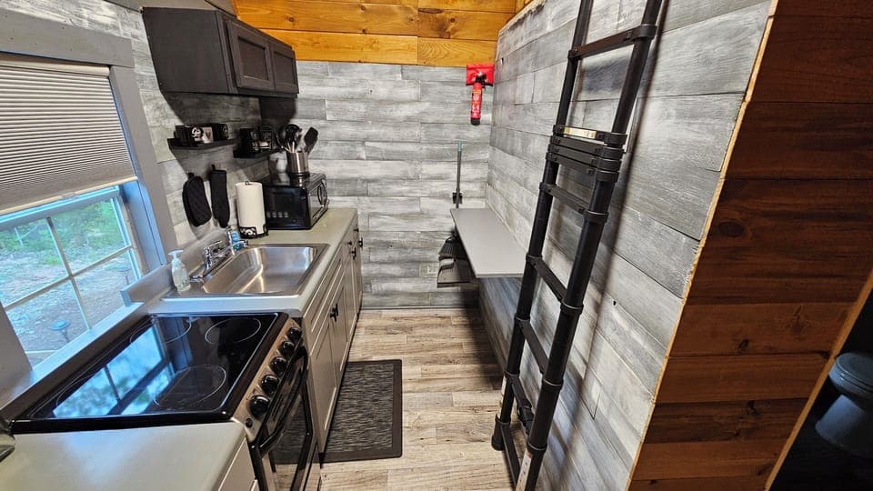 on the right in the kitchen, little bar that folds down, stairs to the loft.