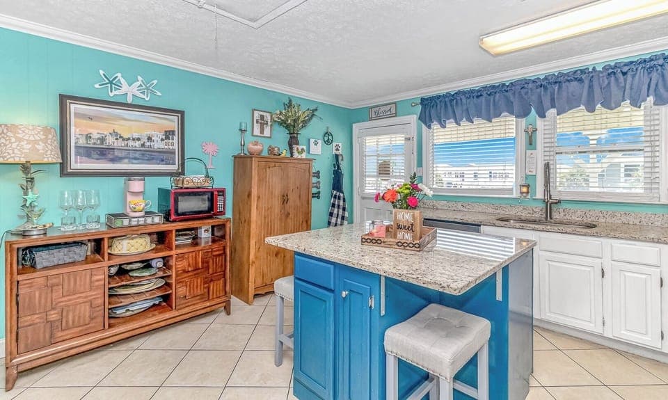 Island seating and plentiful kitchen conveniences provided!