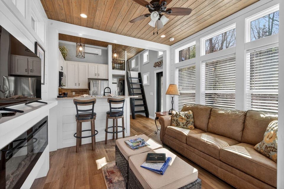 Open living space with full kitchen, loft access, and natural light—ideal for relaxing between hikes
