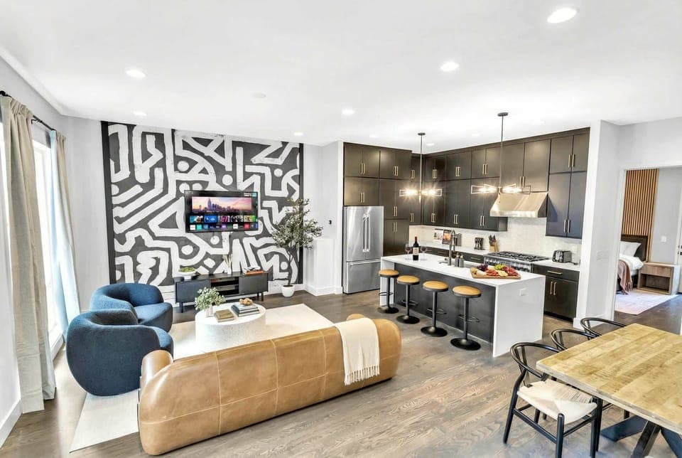 Enjoy your Nashville getaway in this stylish new build, perfect for large groups. Gather at the chic kitchen island or relax in the cozy living area after exploring downtown. Ideal for bachelorette parties or family reunions, this upscale rental offers luxury and comfort in the heart of Music City.