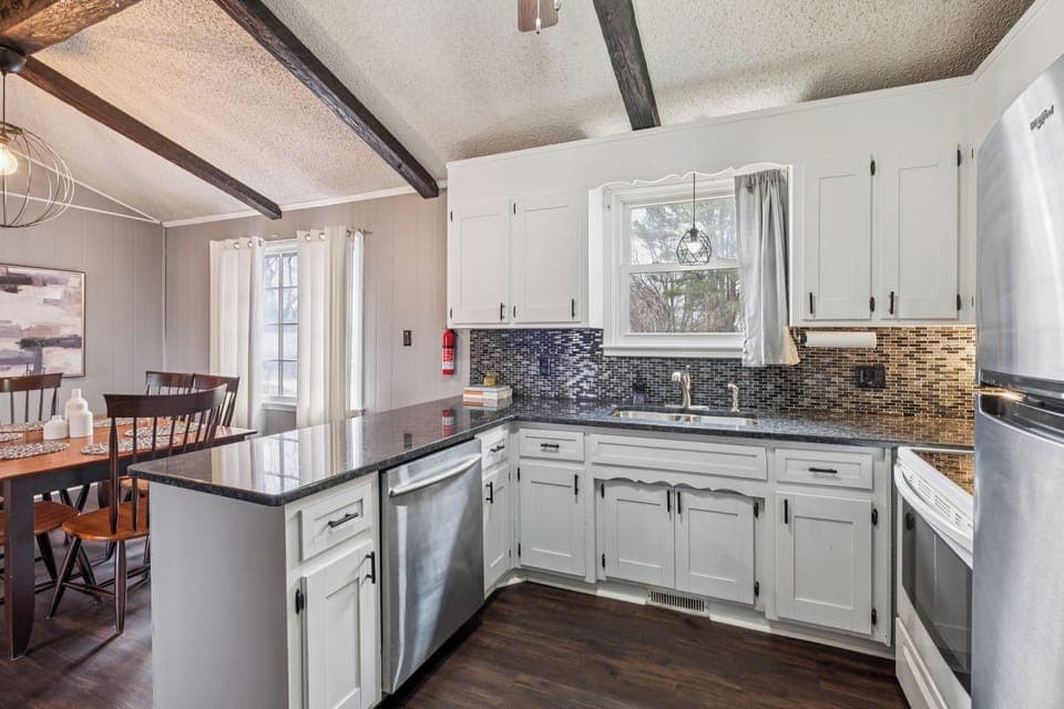 Open concept kitchen with marble counter tops newly renovated