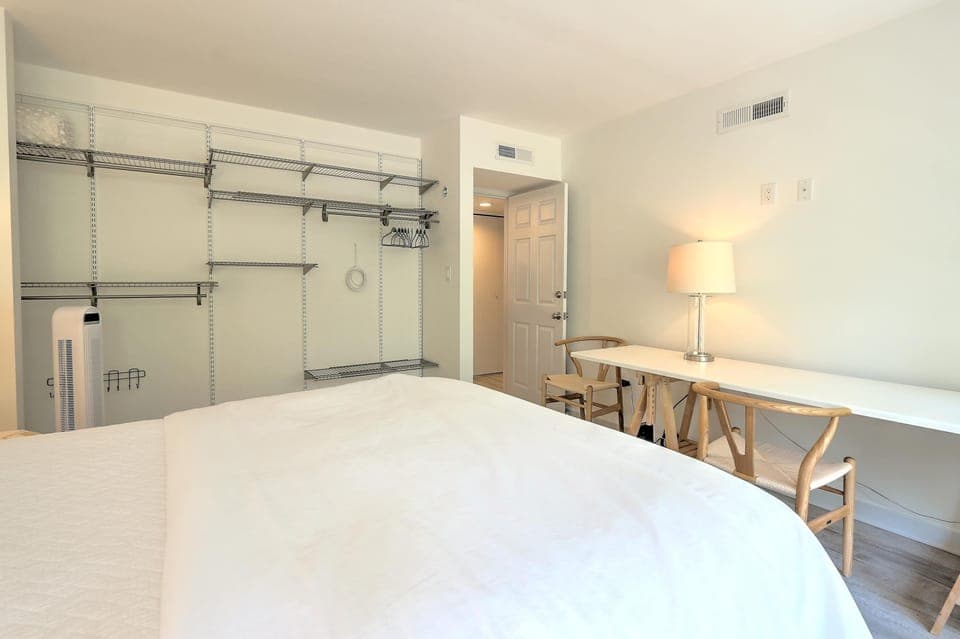 Bedroom 2 with queen bed and balcony 