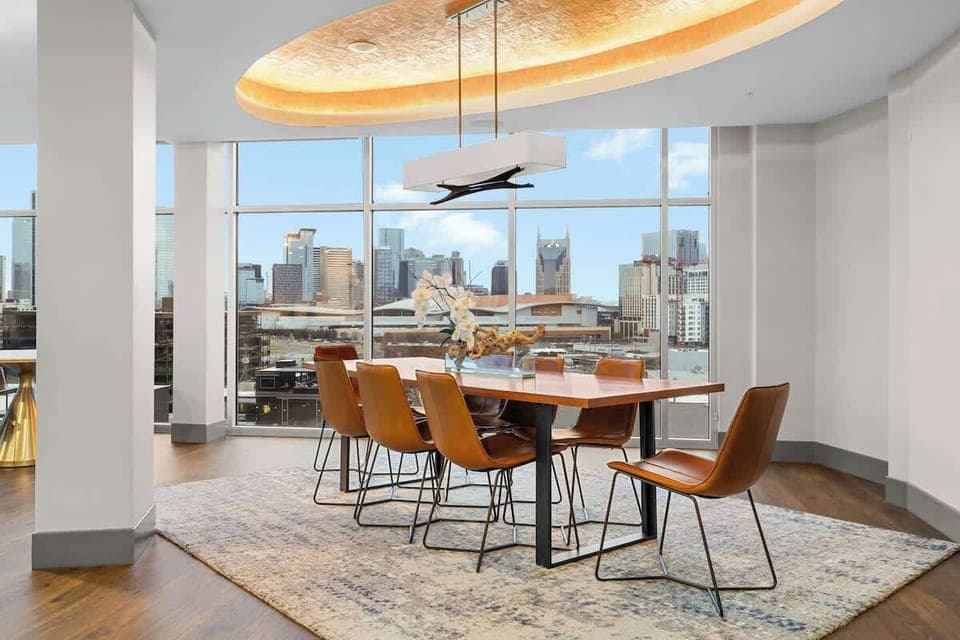 Dining nook glowing w/ big windows & morning light