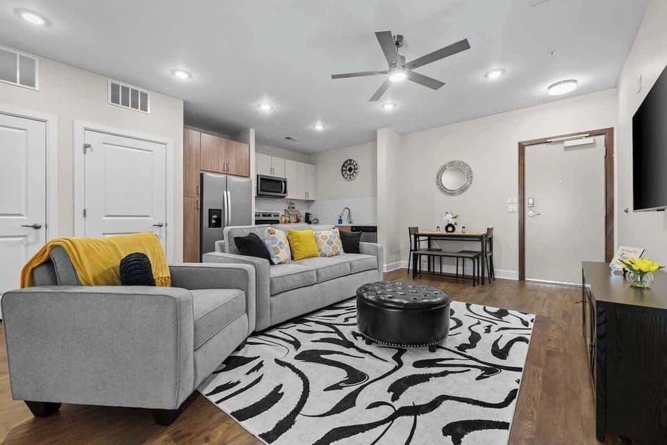 Open living area w/ comfy seating & bold patterns