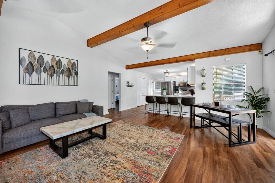 Modern Living Room | Vaulted Ceilings & Exposed Beams | Cozy Fireplace & Open Layout