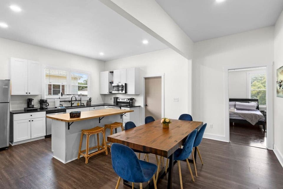 Our dining table seats 6 with an additional 2 bar seats available at our kitchen island. The perfect space to gather, share meals, and create memories with family and friends.