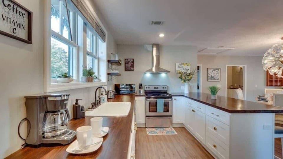 Galley-style kitchen with modern appliances and ample counter space.