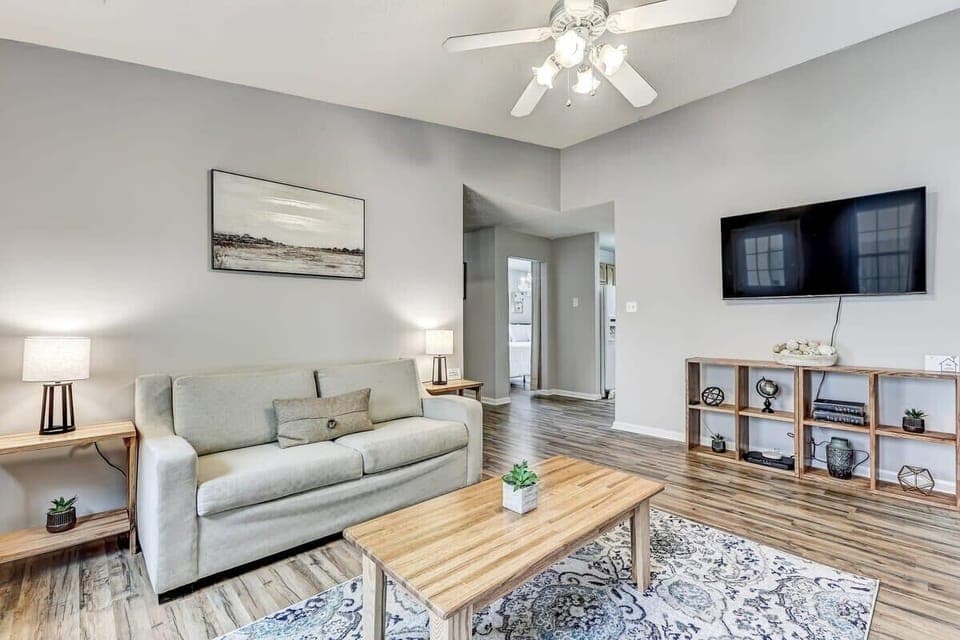 Bright living room with comfortable seating, natural light, and space to relax or gather.