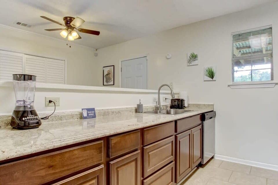 Another view of the well-equipped kitchen showing the range and counter space.