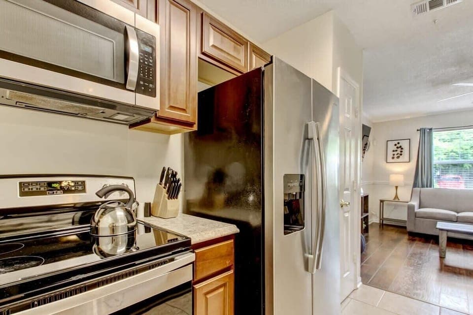 The kitchen comes equipped with essential cookware and appliances.