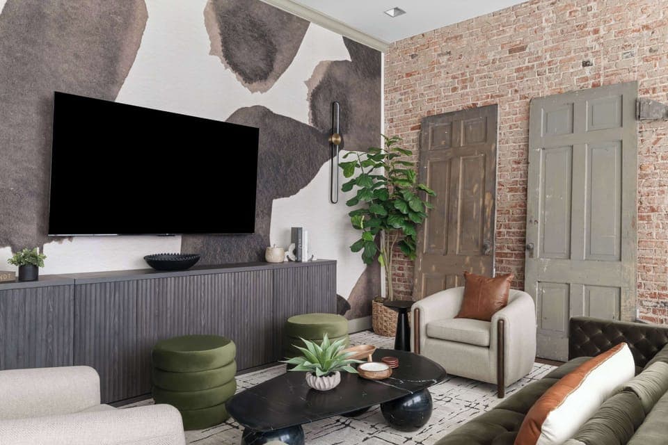 A smart TV paired with stylish seating offers the perfect setup for streaming your favorite shows and gathering with friends or family.