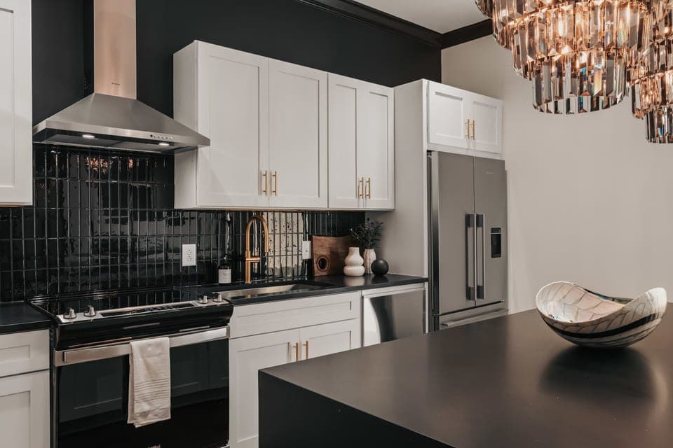 The modern kitchen is fully equipped with stainless steel appliances and thoughtfully stocked with everything you need to cook.