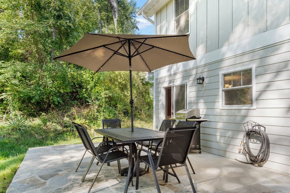 Patio with an al fresco dining area and BBQ grill. (Cherry Blossom)