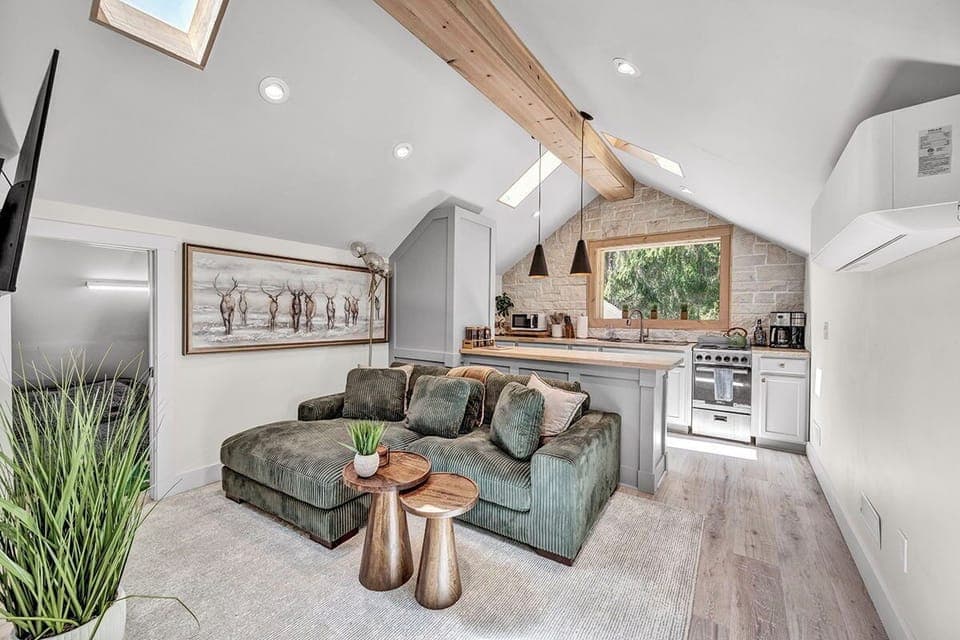 Cozy Living Room with 55-inch Smart TV, Fireplace, and bistro table.