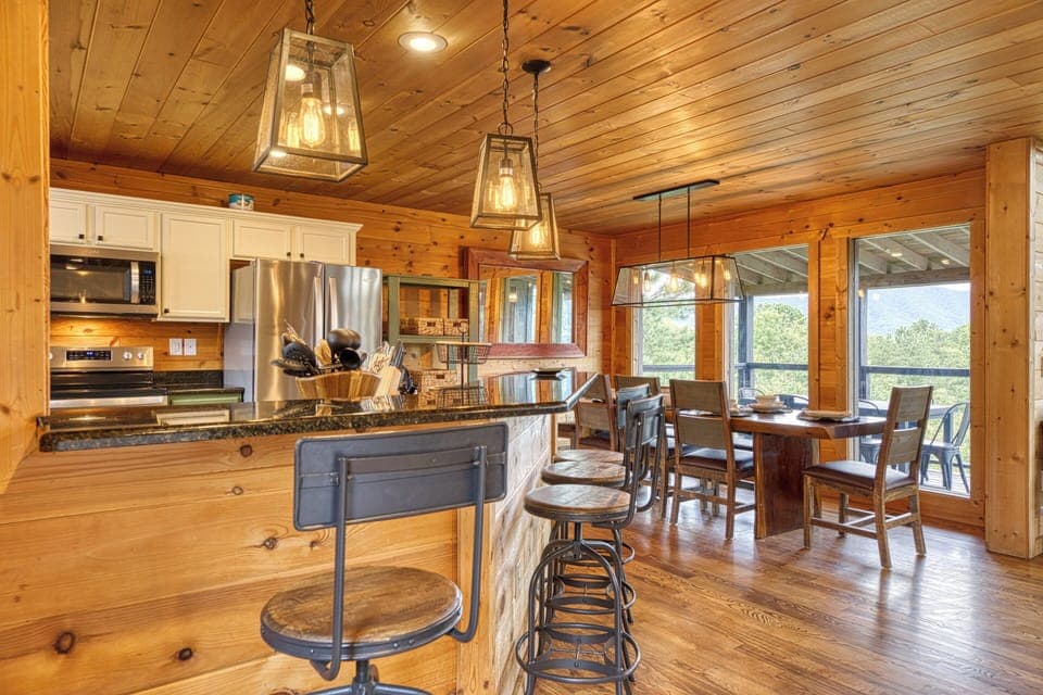 Cook and connect in the open kitchen with stainless appliances and ample counter space.