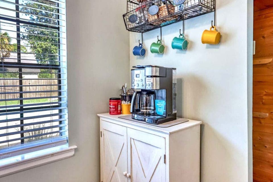Cozy Coffee Bar Corner Start your mornings with fresh coffee at the cheerful coffee nook. A guest favorite, it’s the perfect spot to plan the day or savor a quiet moment before heading out.
