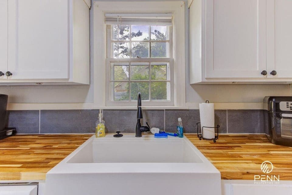Wash up with a peaceful view of the greenery right from the farmhouse sink.