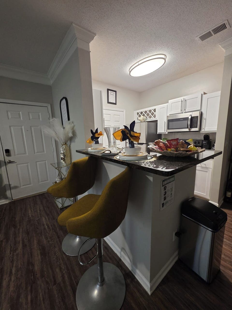 Kitchen peninsula with sink and bar seating great for dining or conversation.
