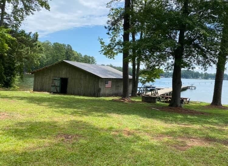 The original 1950's boathouse is equipped with canoe, kayak, and fishing rods